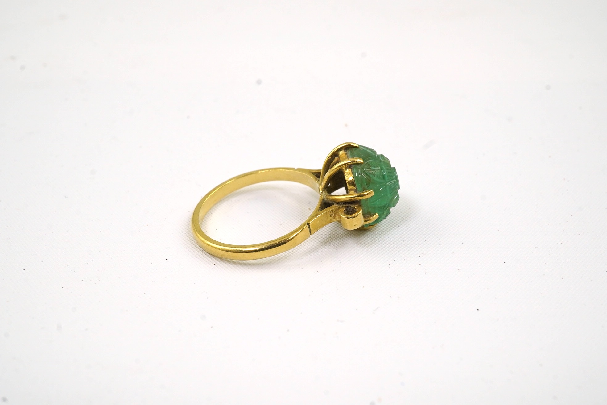 A mid 20th century 18ct gold and single stone emerald set ring